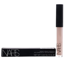 NARS concealer beside coin to show compact size and portability advantage