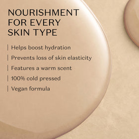Drop of Nativa SPA plum body oil texture on fingertip showing lightweight absorption