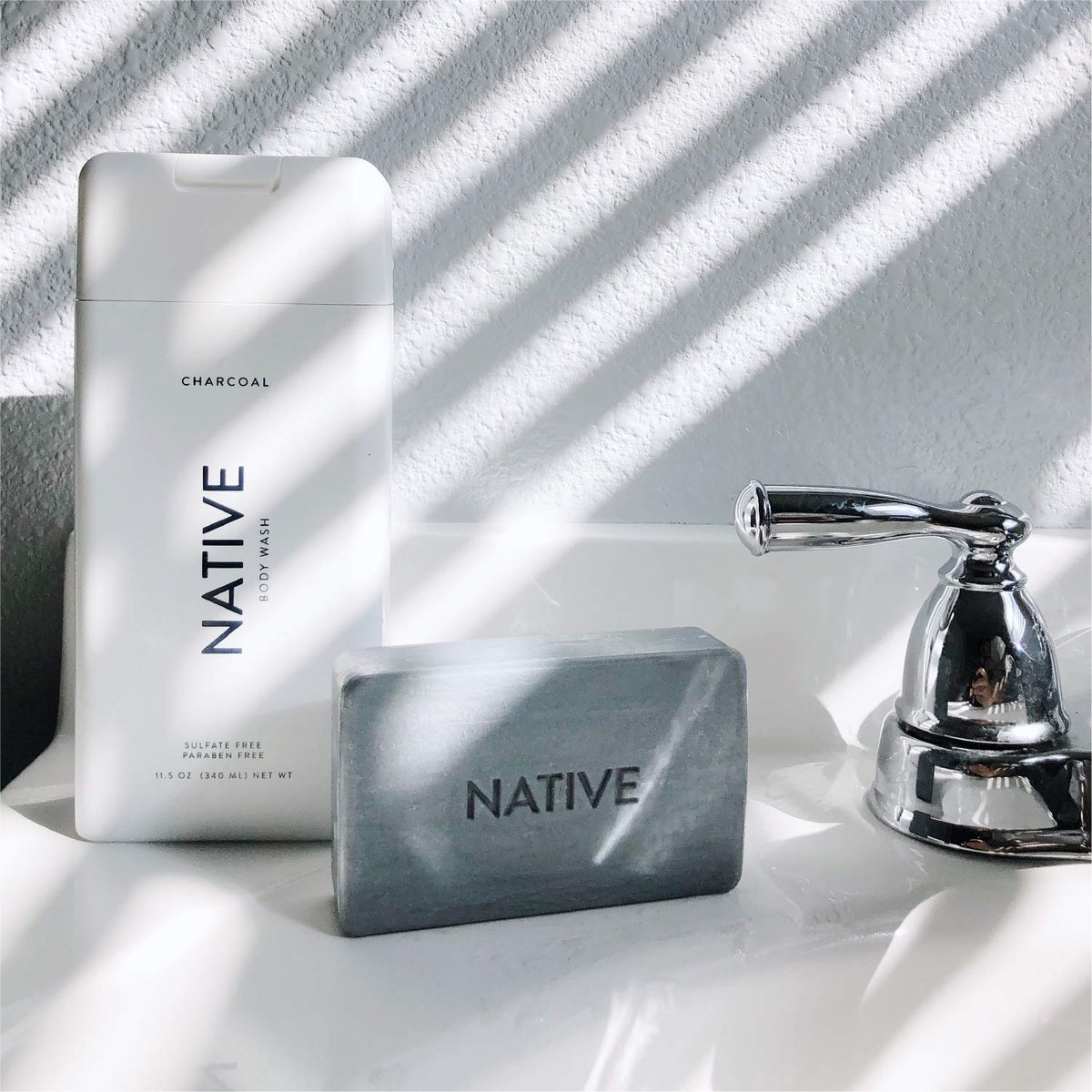 Native bottles styled on bathroom shelf conveying elevated daily routine benefit