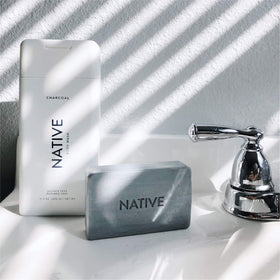 Native bottles styled on bathroom shelf conveying elevated daily routine benefit