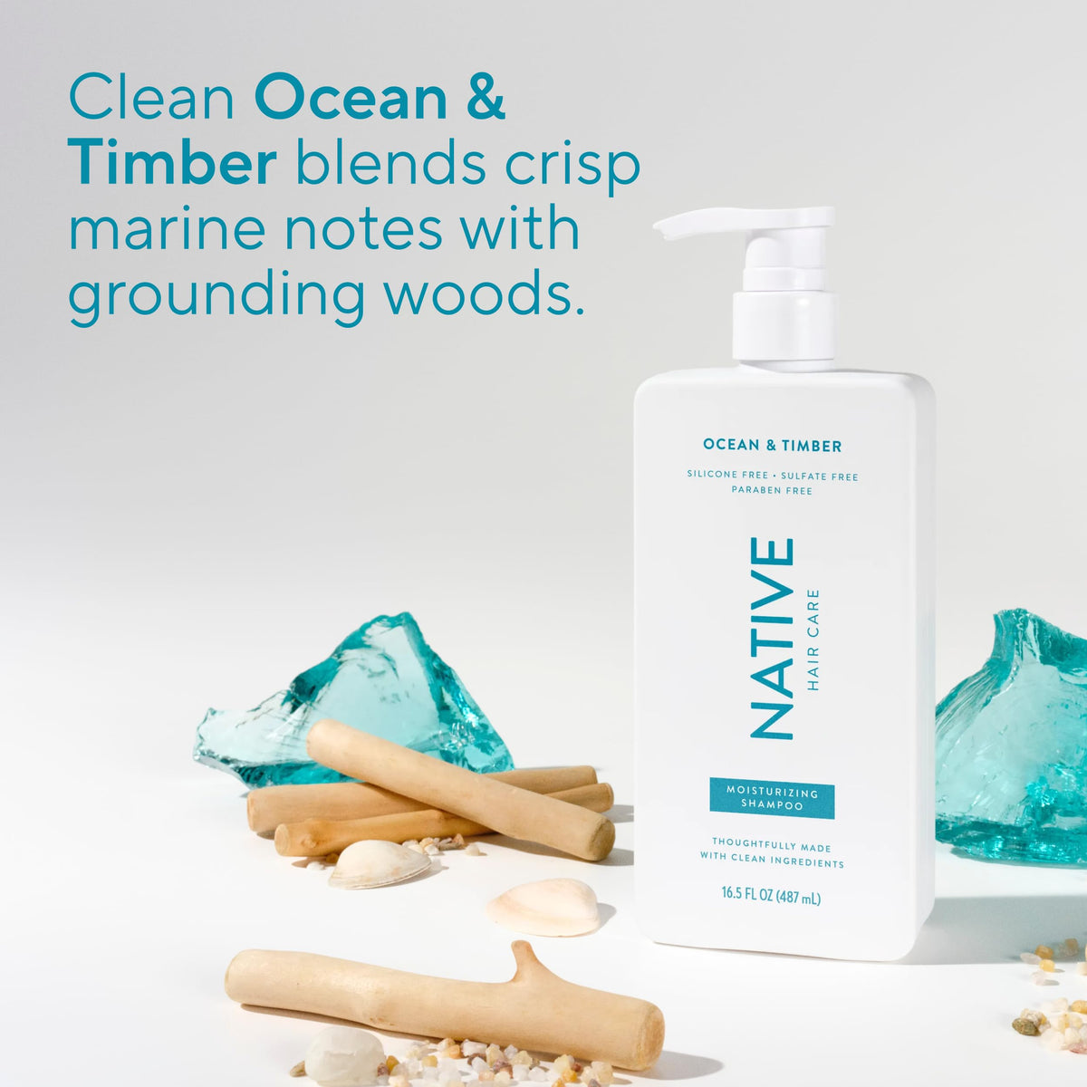 Native scent mood shot with ocean and wood props suggesting fresh, balanced fragrance