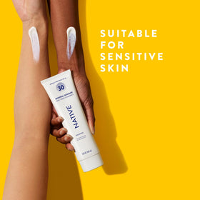 Native applying lotion on arm demonstrating gentle coverage for sensitive skin