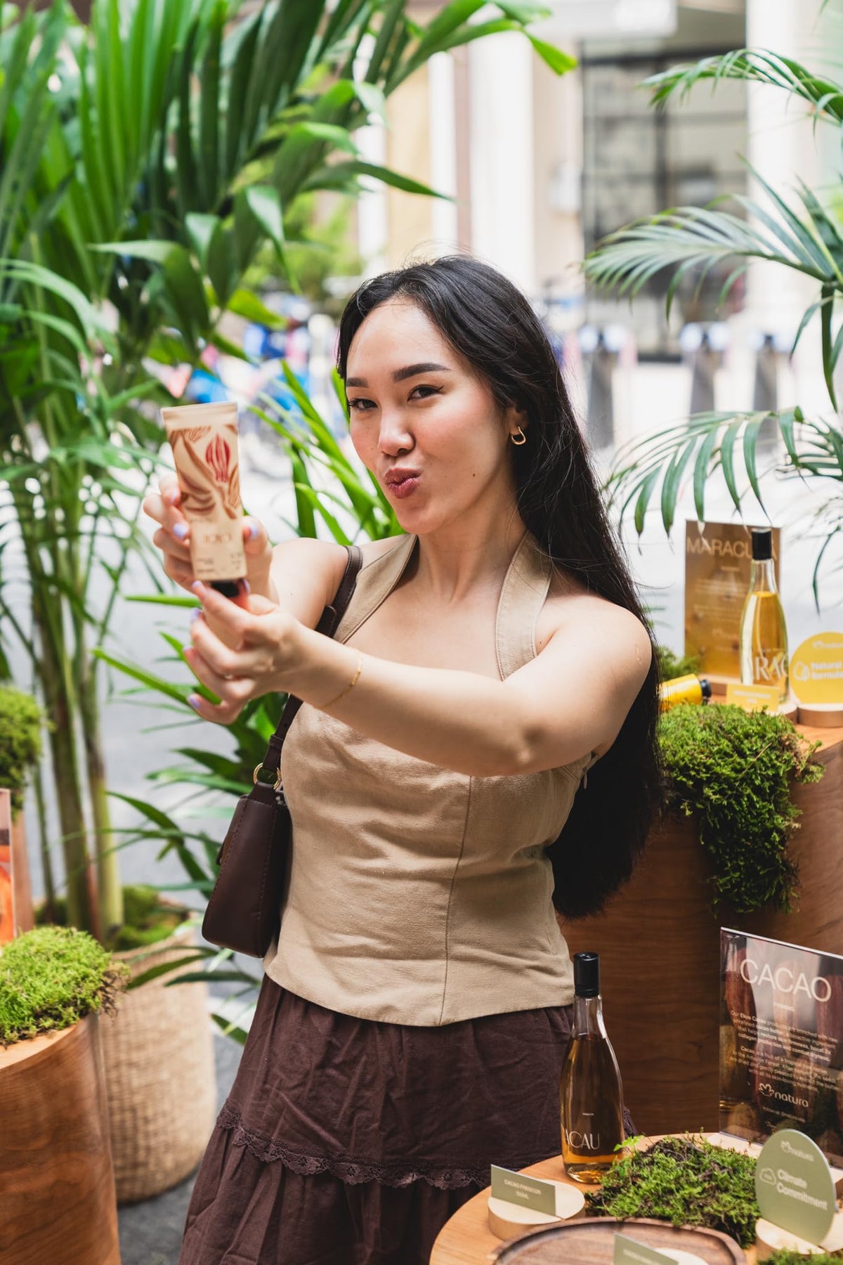 natura Ekos Cacau tucked in a travel pouch, communicates portability for hydration on the go