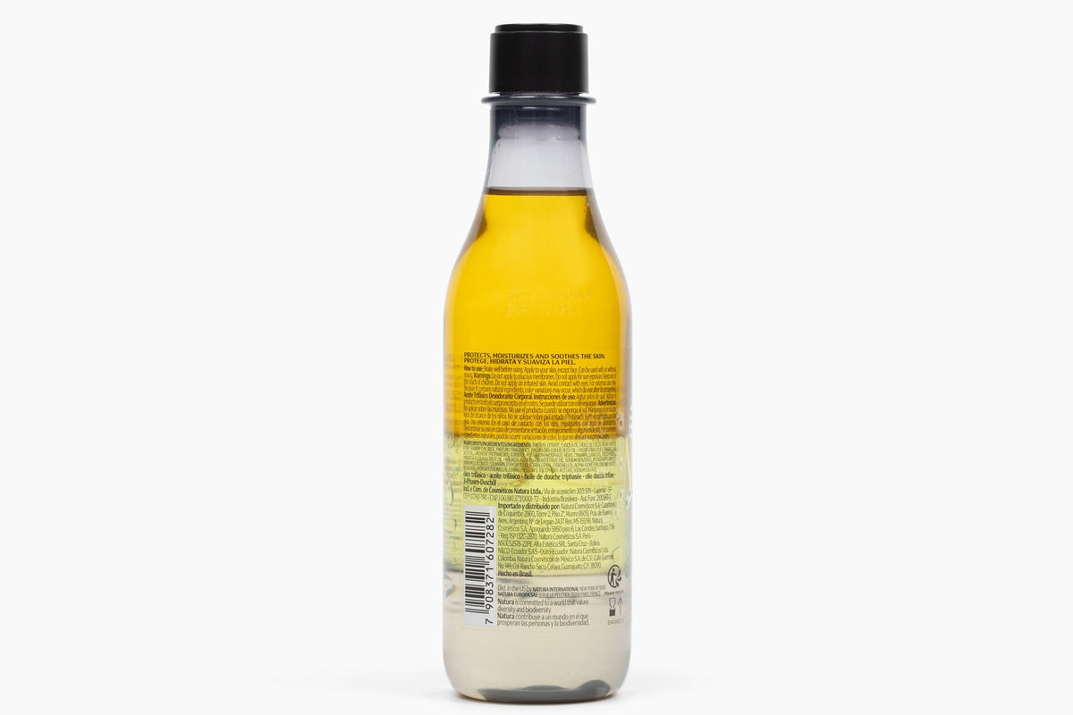 Natura triple phase bottle before shaking, highlights layered oil visual and ritual