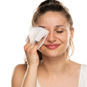 Natural Essentials wipe in hand demonstrating easy, no-rinse use