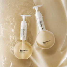 NatureLab.TOKYO bottles held in hands lifestyle conveying everyday use