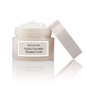 Naturium jar on a bathroom vanity at night suggesting overnight skin-plumping benefit