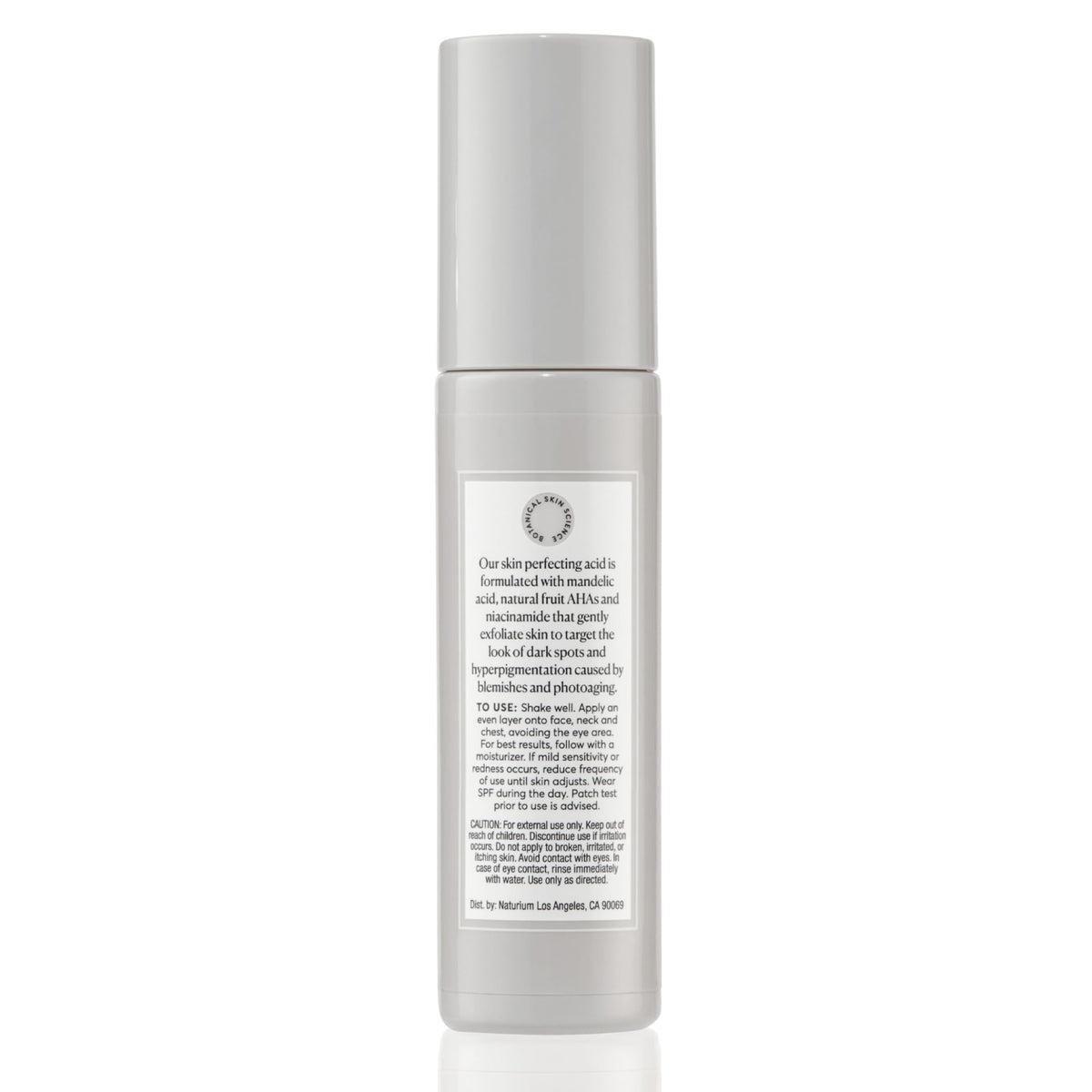 Naturium bottle styled on bathroom shelf conveying everyday routine and elegance