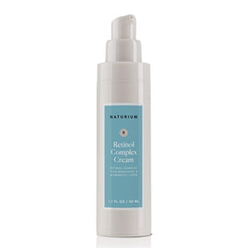 Naturium jar on bathroom counter in a clean skincare routine setting