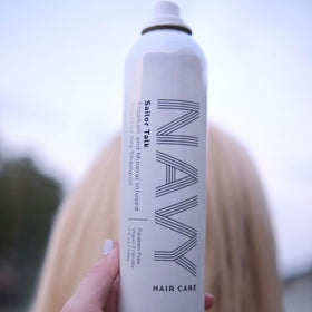NAVY HAIR CARE product being applied to roots to absorb oil and refresh hair quickly