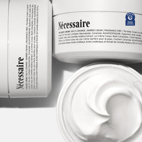 Nécessaire cream texture spread on skin showing rich emollient feel and moisturization