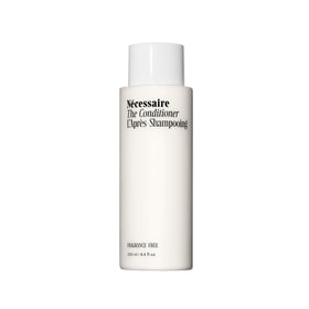 Nécessaire conditioner front packaging showing clean bottle and product clarity