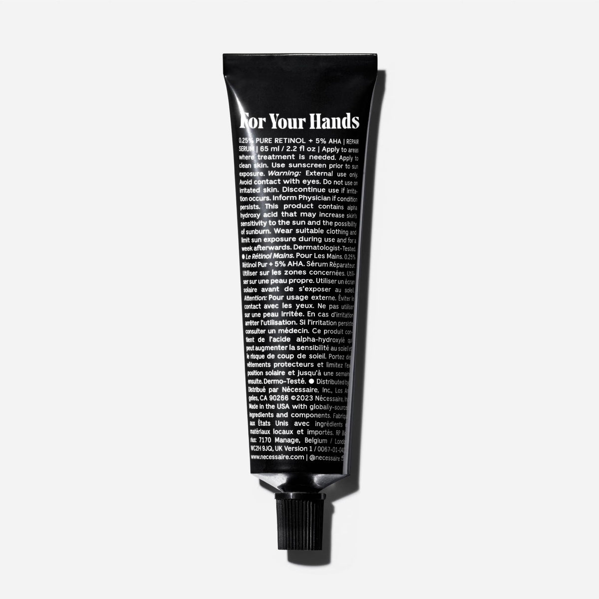 Nécessaire balm texture on fingertip demonstrating nourishing spreadability