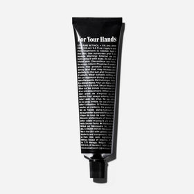 Nécessaire balm texture on fingertip demonstrating nourishing spreadability