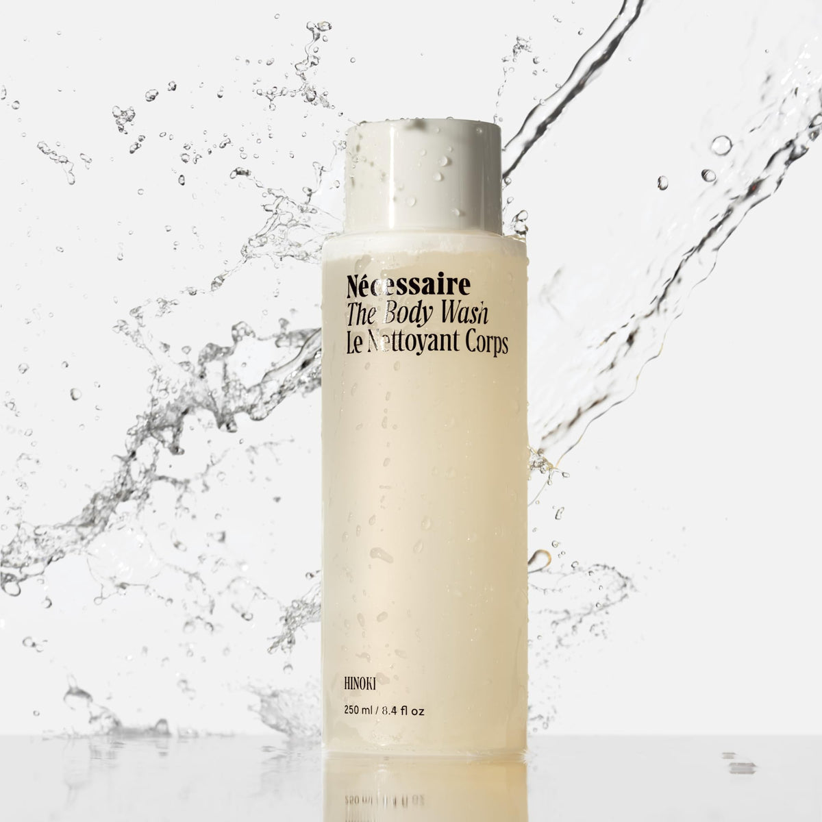 Nécessaire pump and label detail highlighting ingredients and clarity