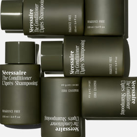 Nécessaire dispensing conditioner from bottle demonstrating easy application