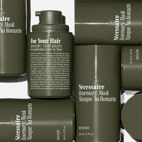 Nécessaire product in hand to show 60 ml scale and travel-friendly size