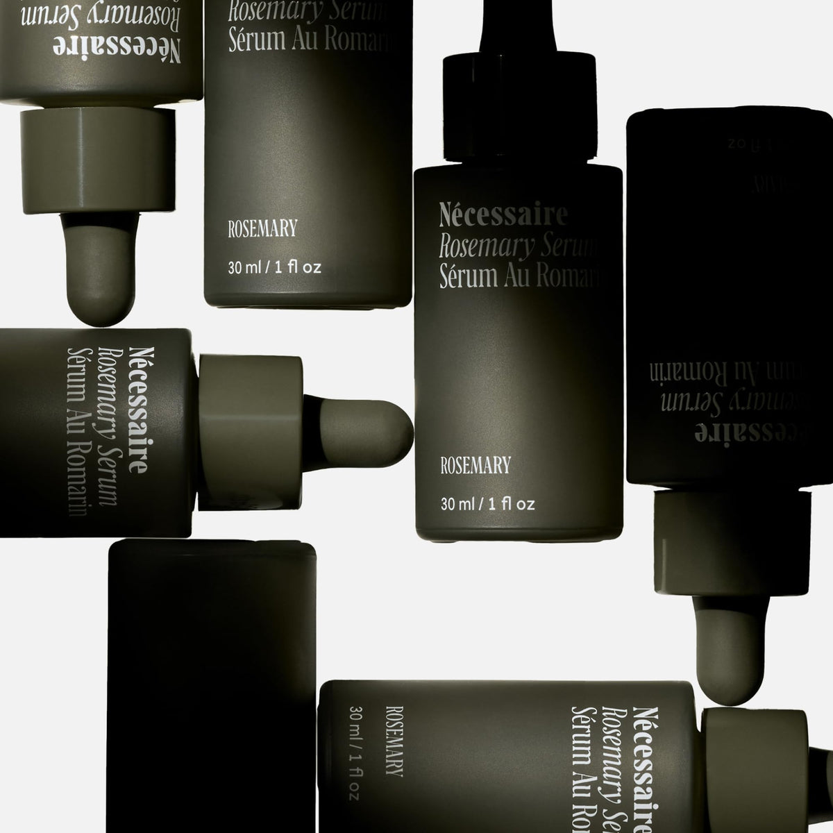 Nécessaire dropper dispensing clear serum for targeted scalp application