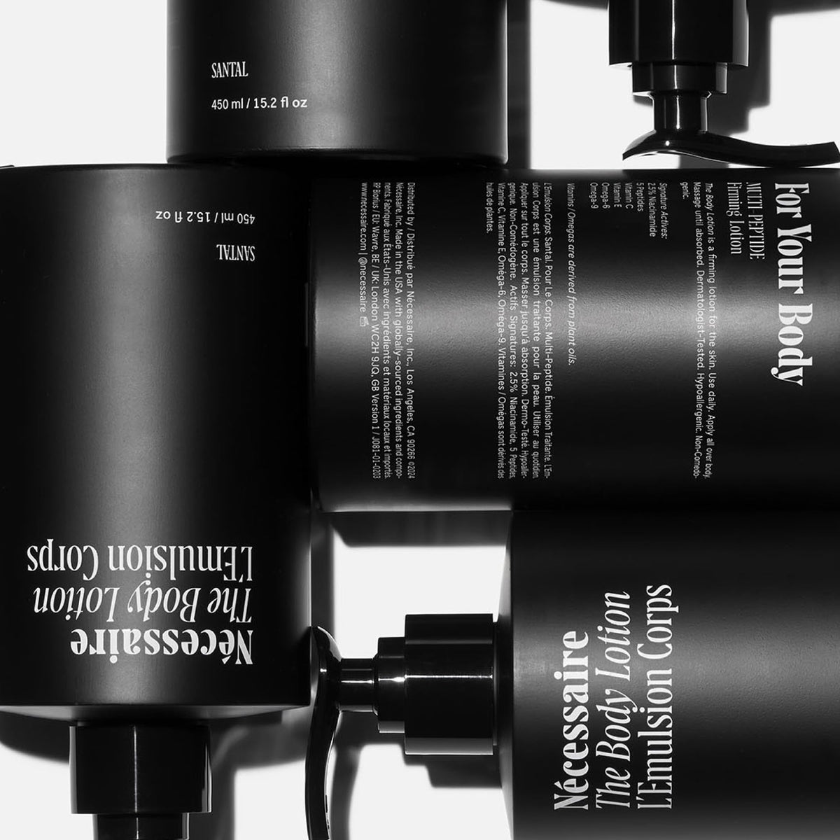 Nécessaire pump dispensing lotion to show easy, hygienic one-handed application