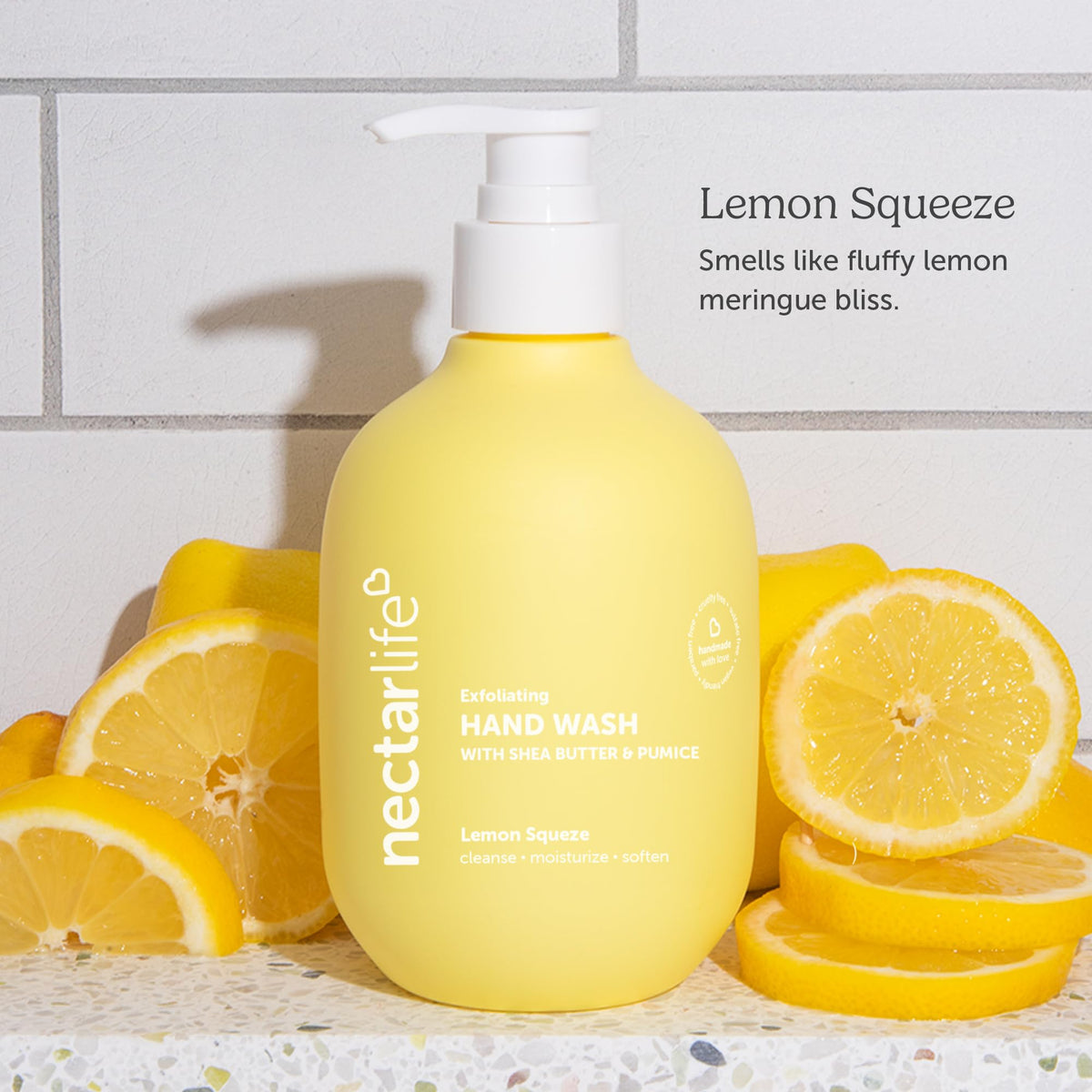 Nectar Bath Treats size comparison with hand to show 14 fl oz bottle capacity