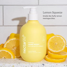 Nectar Bath Treats size comparison with hand to show 14 fl oz bottle capacity
