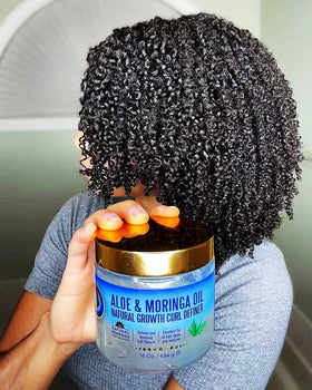 Nefertiti's Secrets on model showing natural shiny defined curls