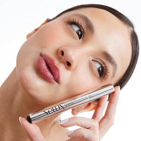Nelux in a handbag lifestyle shot for on-the-go hydration benefit