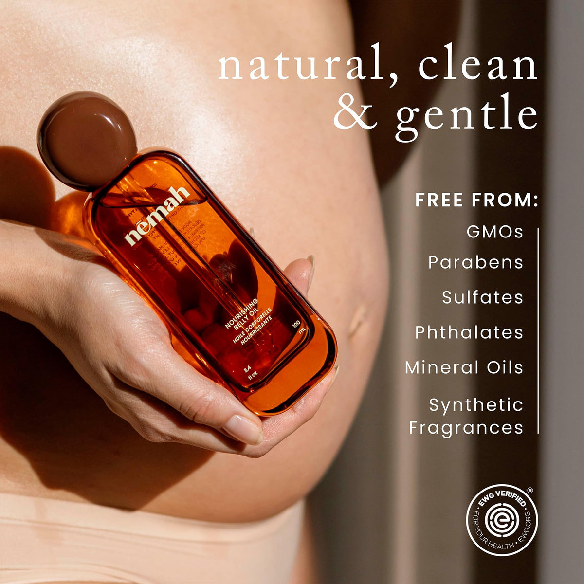 Nemah bottle next to hand to show 3.4 fl oz size and easy‑carry convenience