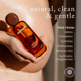 Nemah bottle next to hand to show 3.4 fl oz size and easy‑carry convenience
