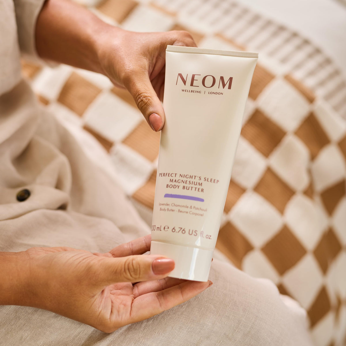 Close-up of Neom body butter texture highlighting creamy magnesium-rich formula