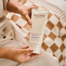 Close-up of Neom body butter texture highlighting creamy magnesium-rich formula