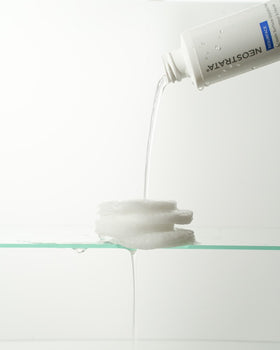 NEOSTRATA on bathroom counter with towel portraying nightly skincare routine