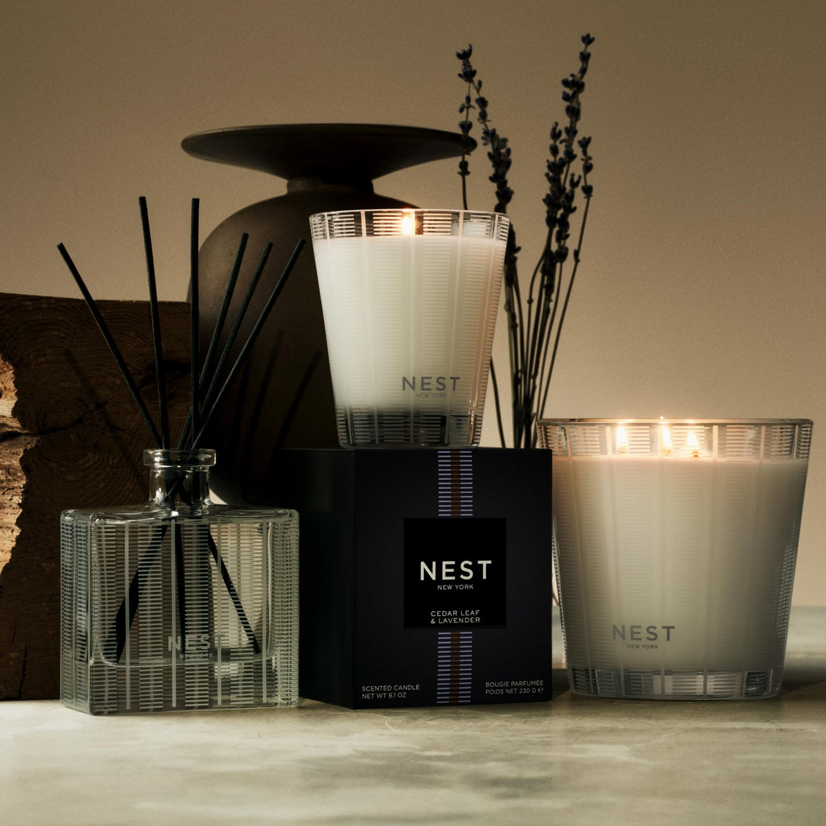 NEST New York bottle beside a hand for scale showing 10 fl oz convenience