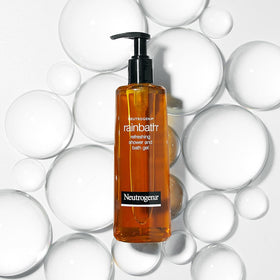 Neutrogena Rainbath bottle on bath ledge with towel suggesting relaxing, conditioned skin