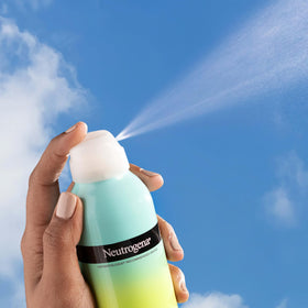 Neutrogena bottle in hand to show 6.7 oz travel-friendly benefit
