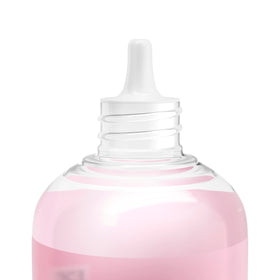 Neutrogena bottle in hand to show true 4 fl oz scale