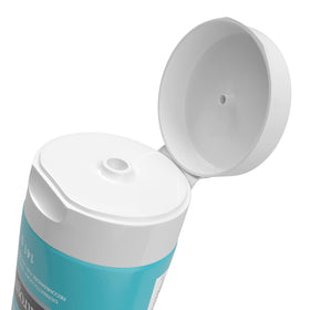 Neutrogena tube beside coin showing 5 oz size for scale and travel convenience