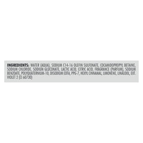 Nexxus 33.8 oz bottle next to ruler showing large, economical size benefit