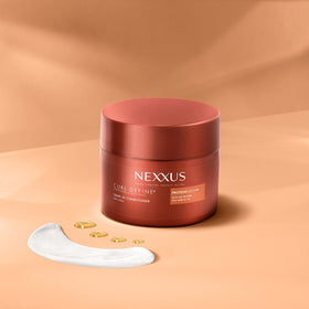Nexxus 8 oz bottle next to ruler showing compact travel-friendly size