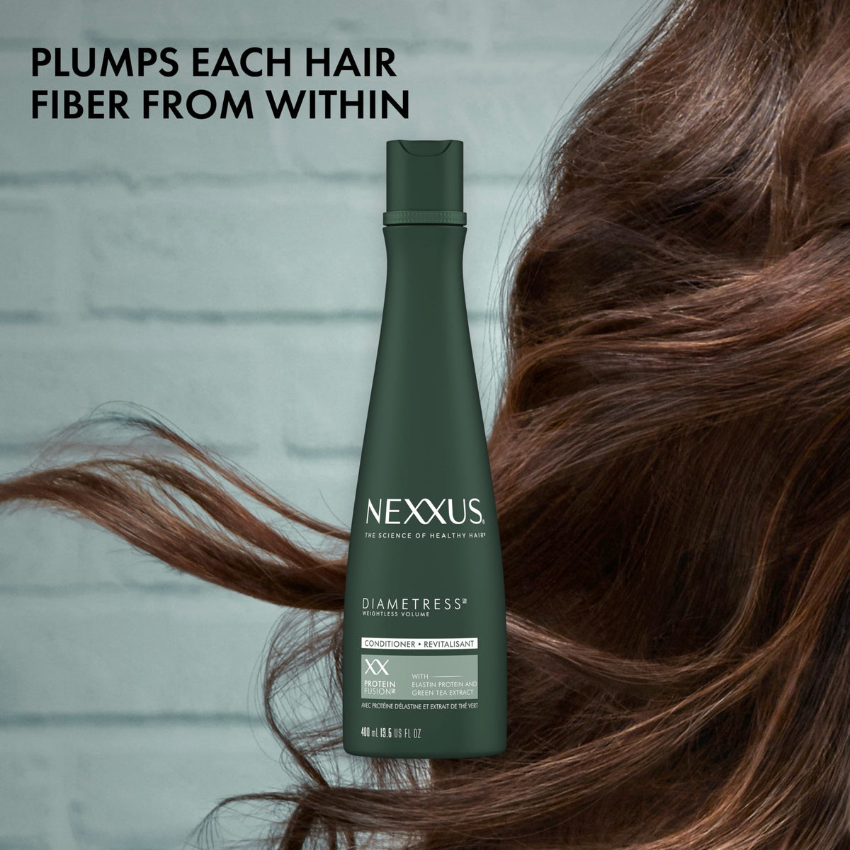 Nexxus Diametress conditioner in shower applied to wet hair for volumizing benefit