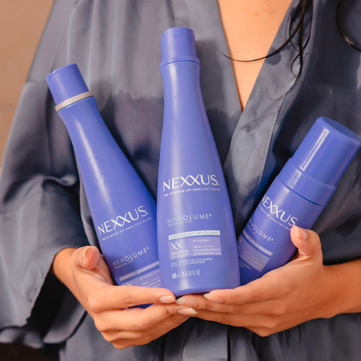 Nexxus Hy‑Volume bottles side‑by‑side to display actual product sizes