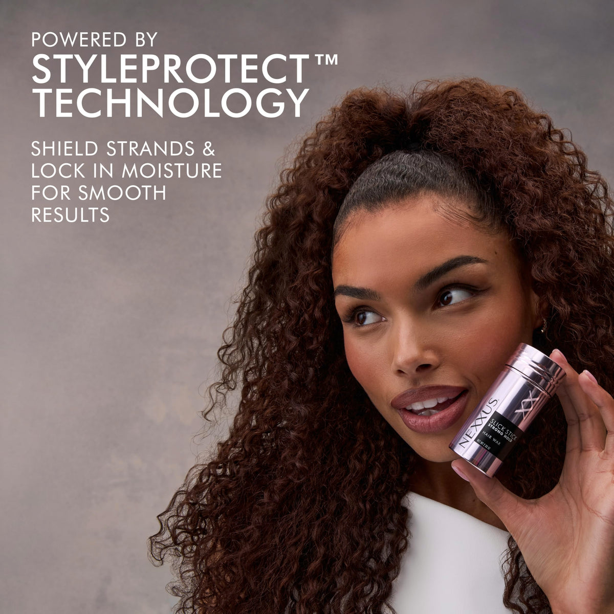 Nexxus slick stick application on hair for precise styling control