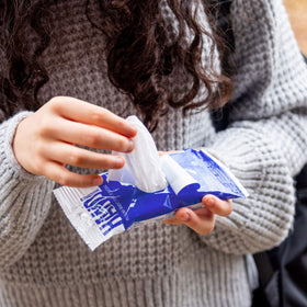 Nice 'N Clean pack inside a purse showing portability and on-the-go convenience