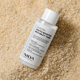 NIDA bottle on bathroom vanity, lifestyle scene suggesting daily use