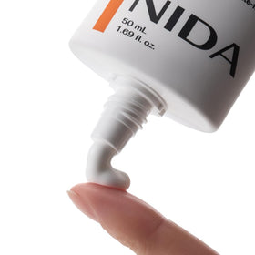 NIDA ingredient panel featuring Vitamin B5 and E for hydration and protection