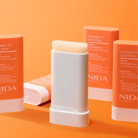 NIDA sun stick on skin showing invisible finish and natural subtle glow