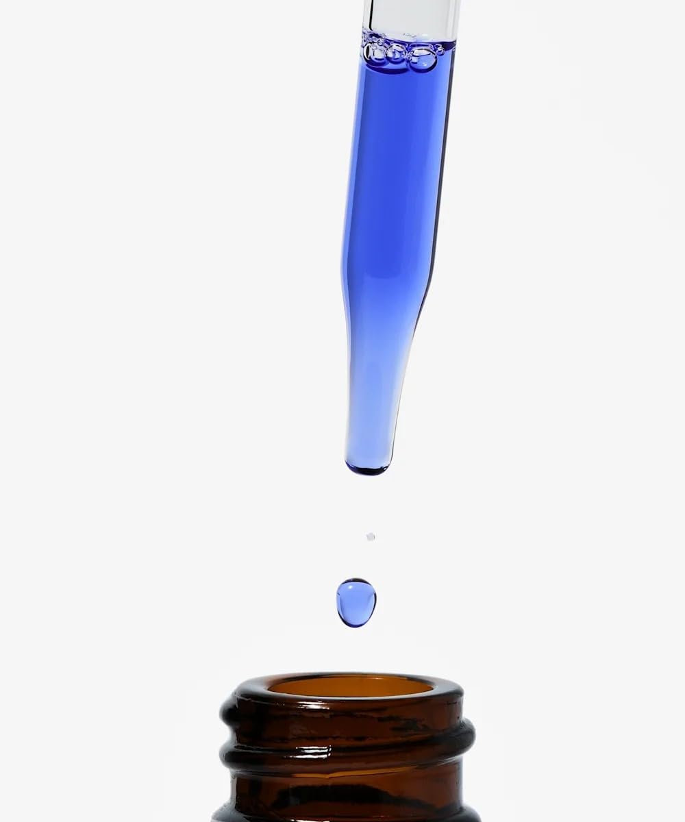 NIOD serum texture poured on hand illustrating lightweight absorbent finish