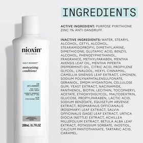 nioxin bottle on bathroom shelf conveying daily scalp care routine