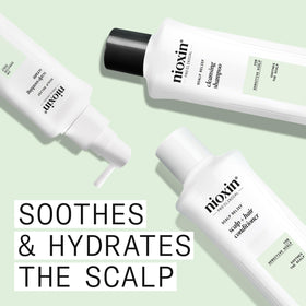 Nioxin conditioner texture close-up showing nourishing cream