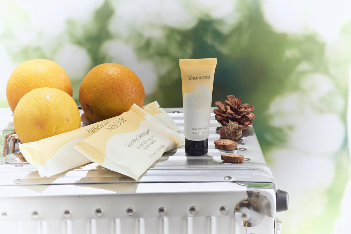NISGUR pouch placed on hotel bathroom shelf for guest use